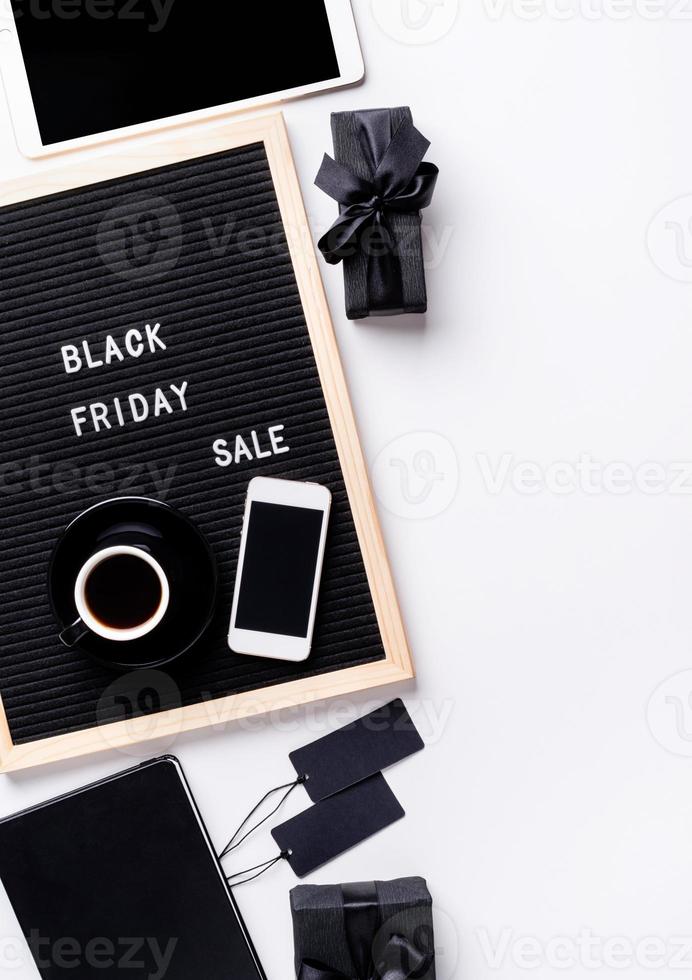 Text black friday sale on black letter board with cup of coffee photo