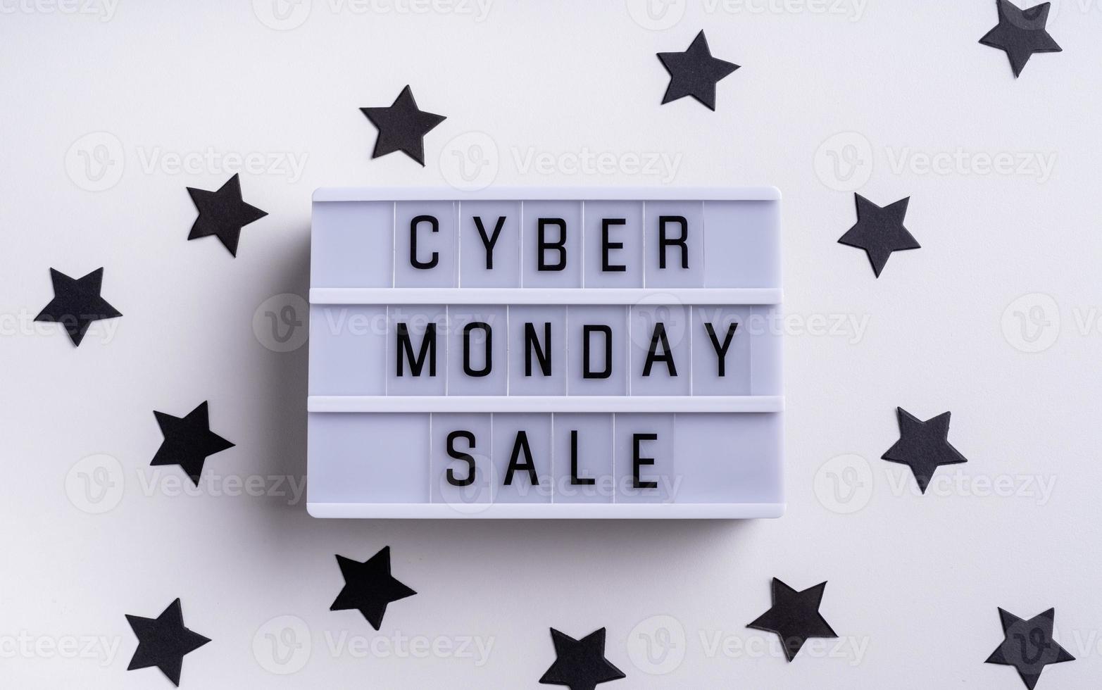 Cyber Monday Sale words on lightbox with confetti top view photo