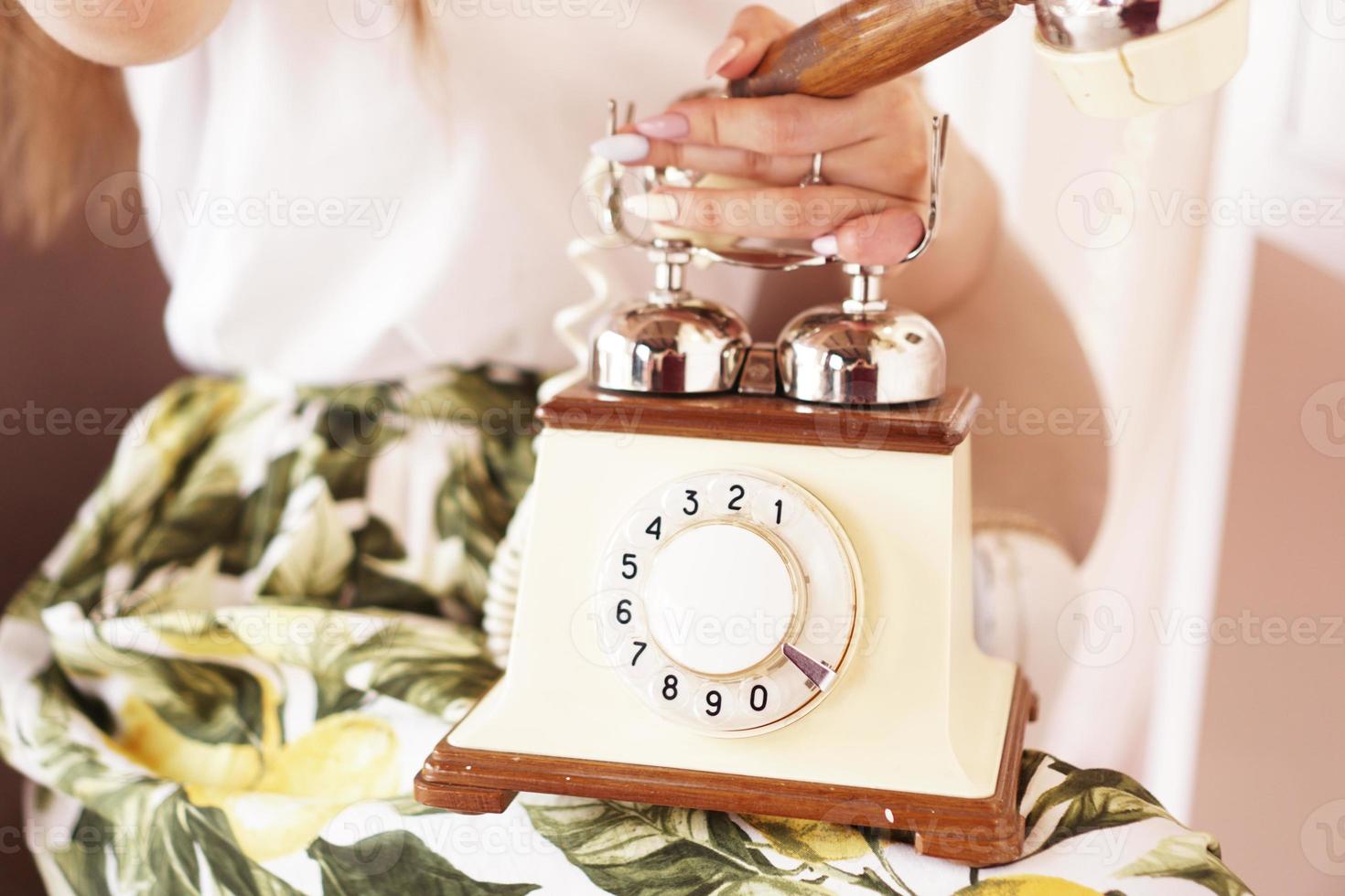 Woman Holding Retro Phone - bright photo