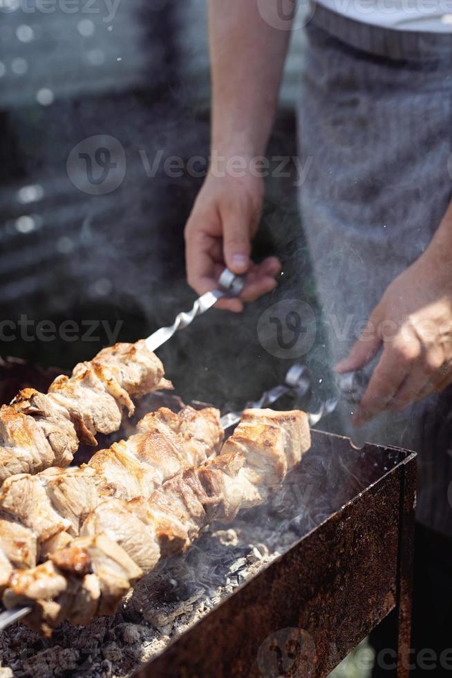 Grilled kebab on metal skewer, fresh meat photo