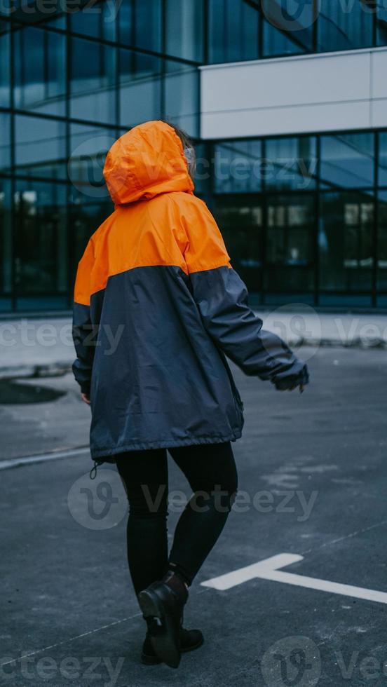 Girl in protective overalls and glasses. Air pollution concept photo