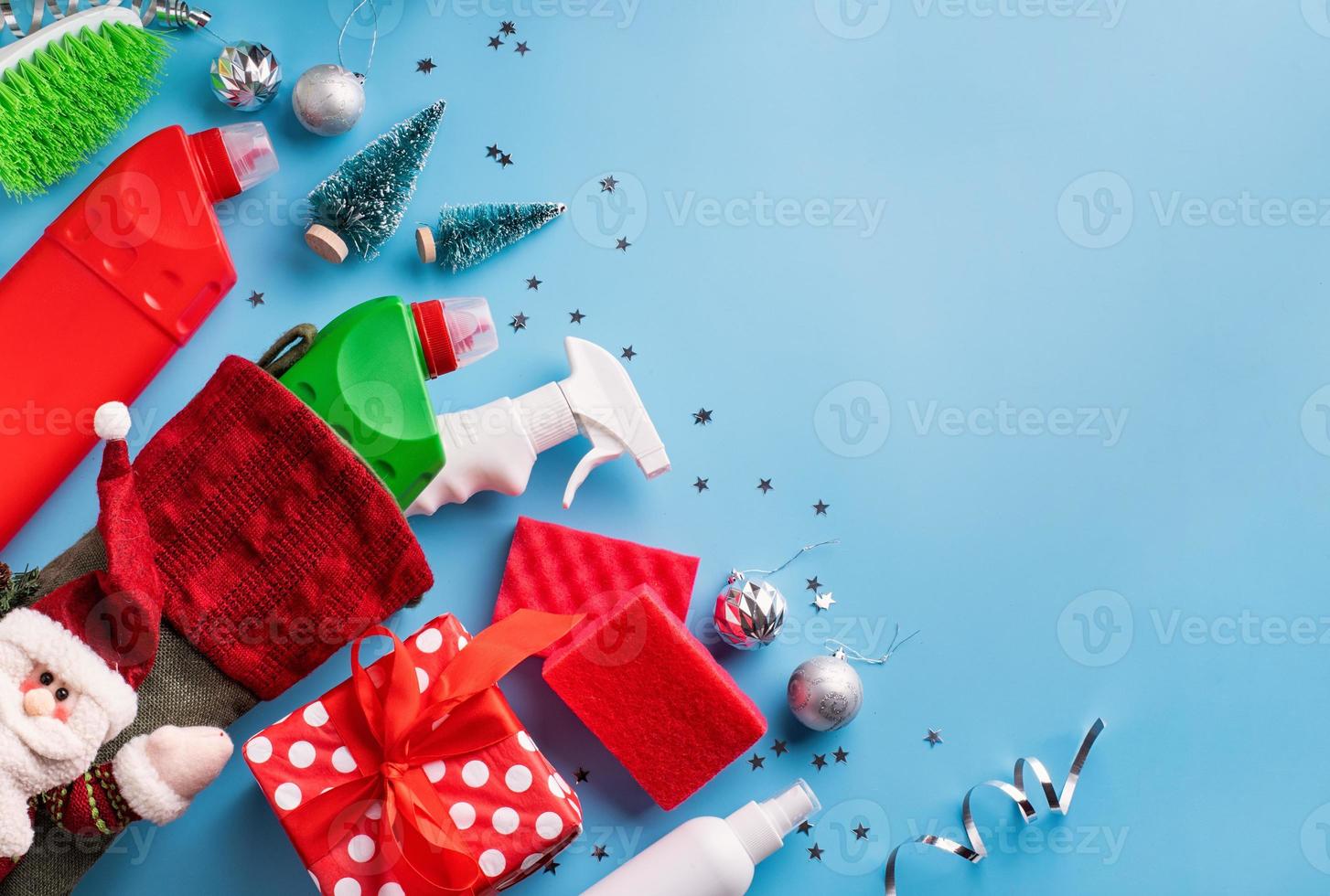 Cleaning tools and materials in Christmas stocking, top view, flat lay photo