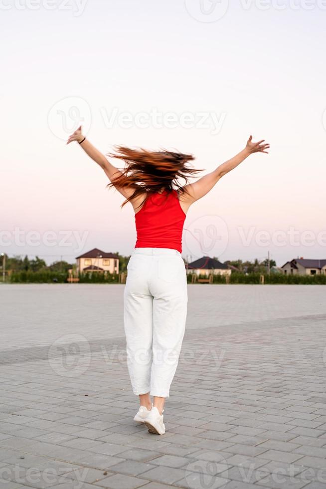 Woman dancing at the park photo