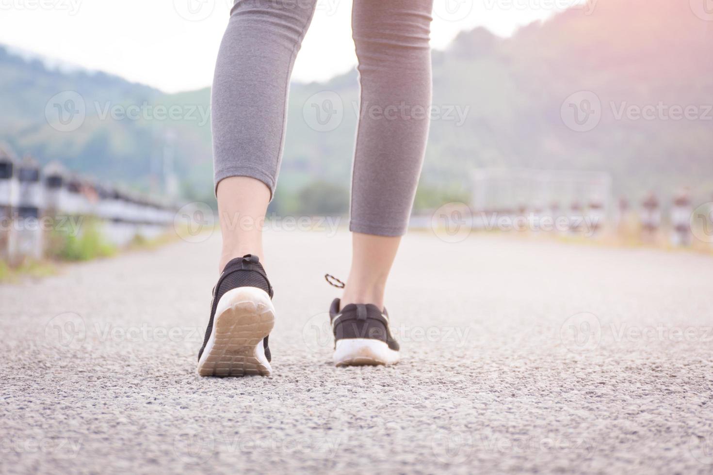 Woman walking on road photo