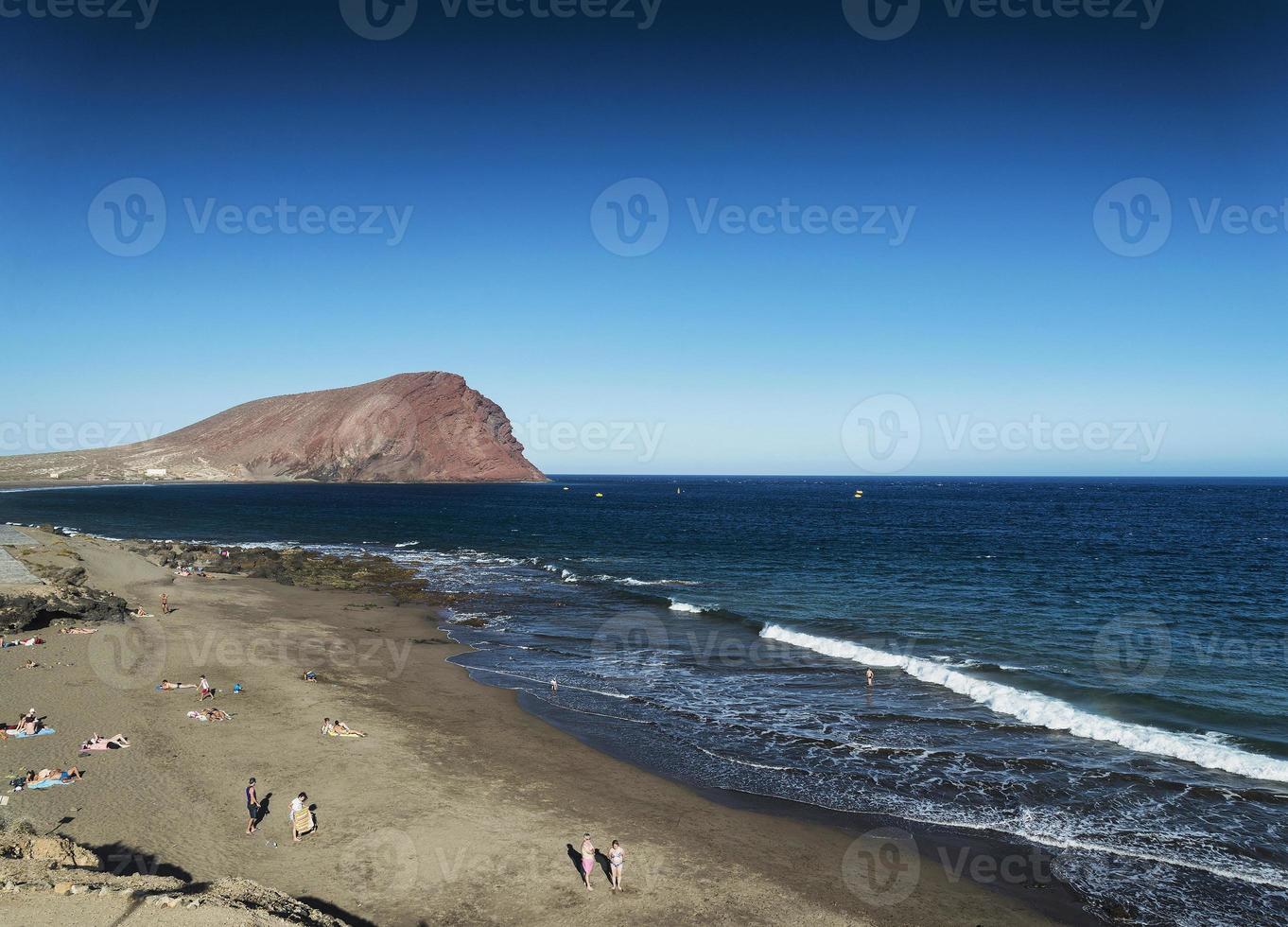 Las Tejitas volcanic beach and Montana Roja landmark landscape in south Tenerife Spain photo