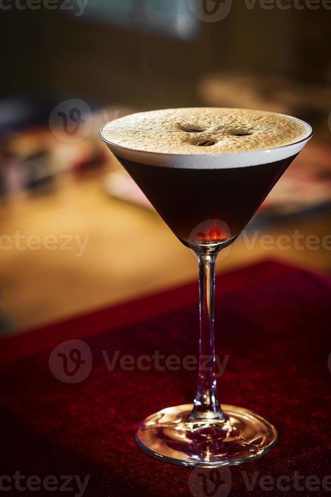 Espresso coffee martini cocktail drink in bar at night photo