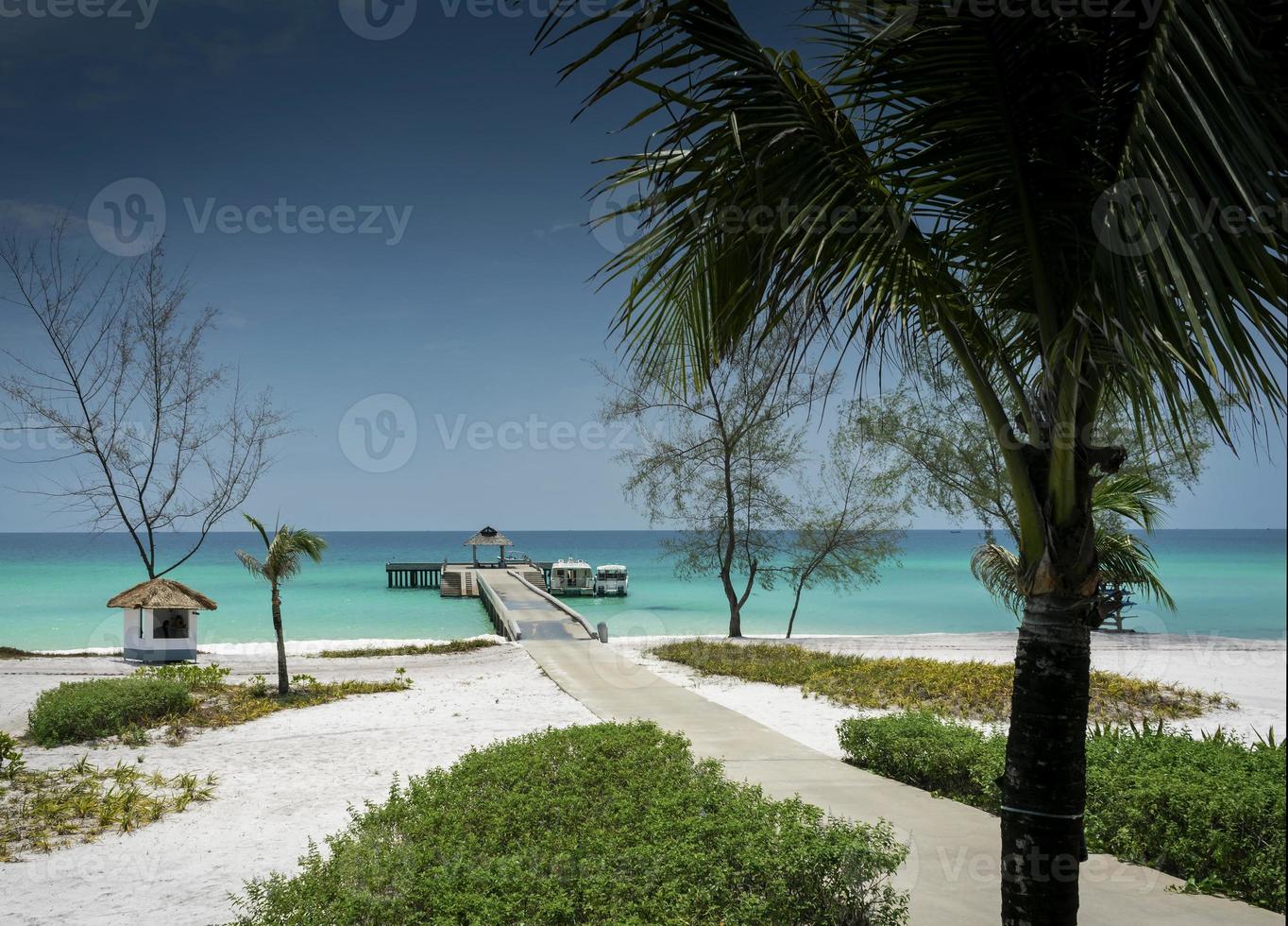 Ferry boat pier on paradise Koh Rong island beach near Sihanoukville Cambodia photo