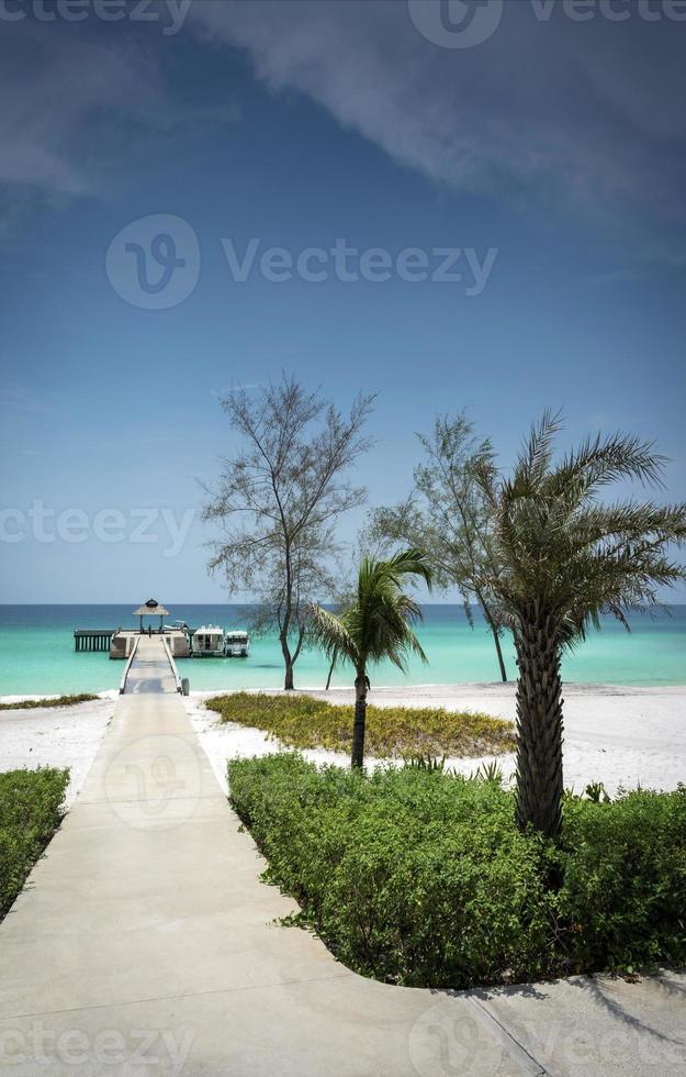 Ferry boat pier on paradise Koh Rong island beach near Sihanoukville Cambodia photo