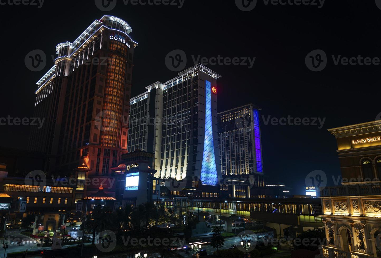 Casino hotel resorts neon on Cotai strip Macao Macau China at night photo