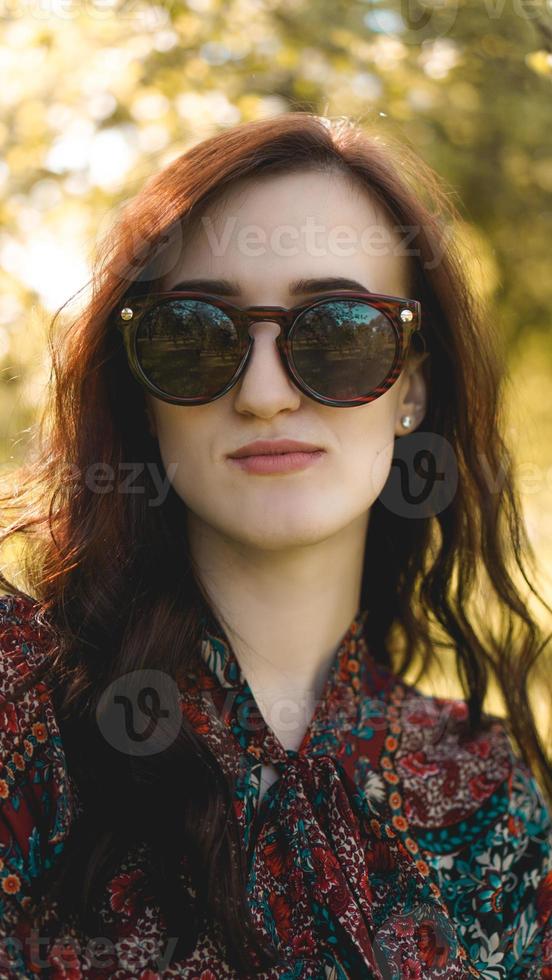 Smiling summer woman with sunglasses photo