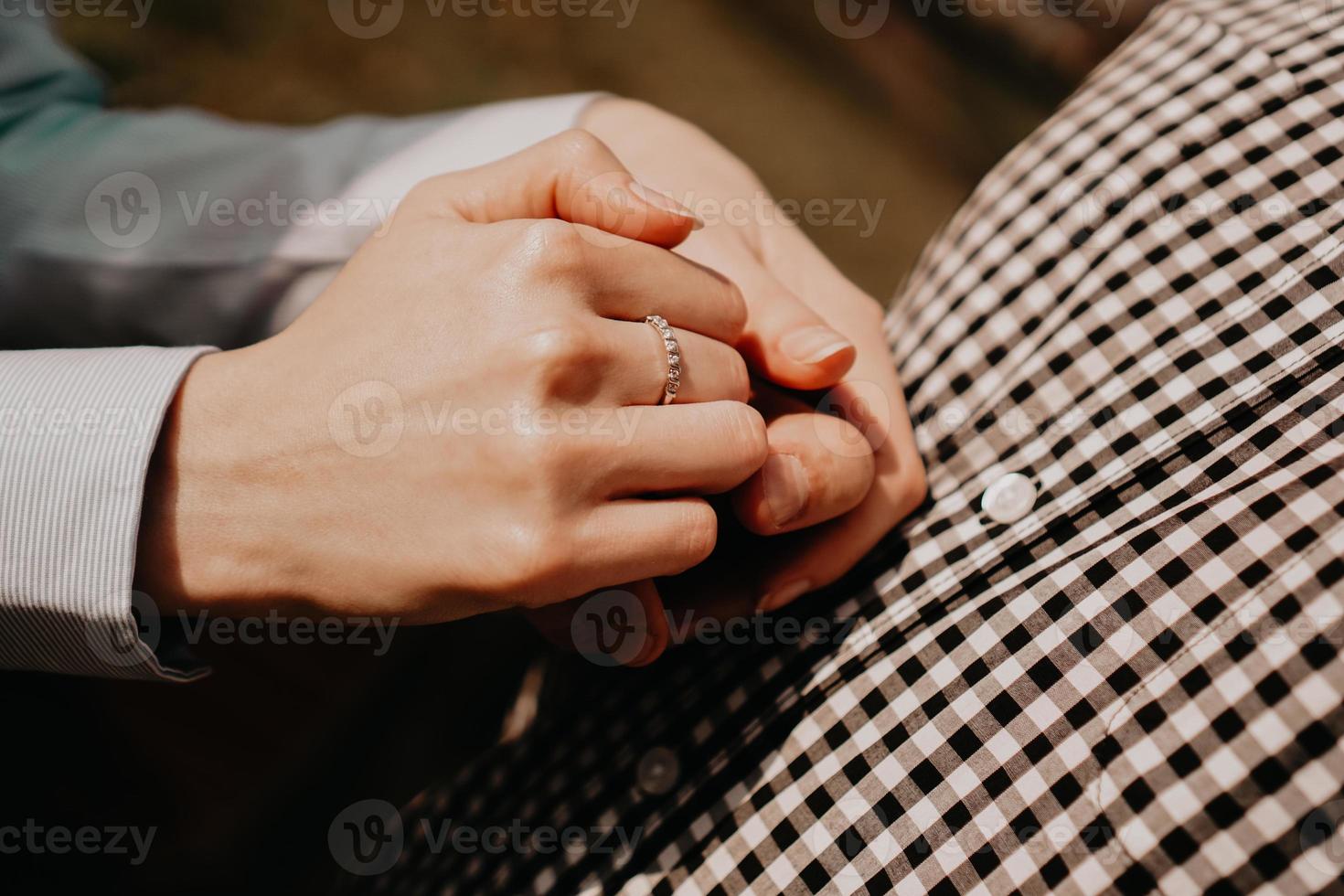 Hands of couple. Couple of lovers holding hands photo