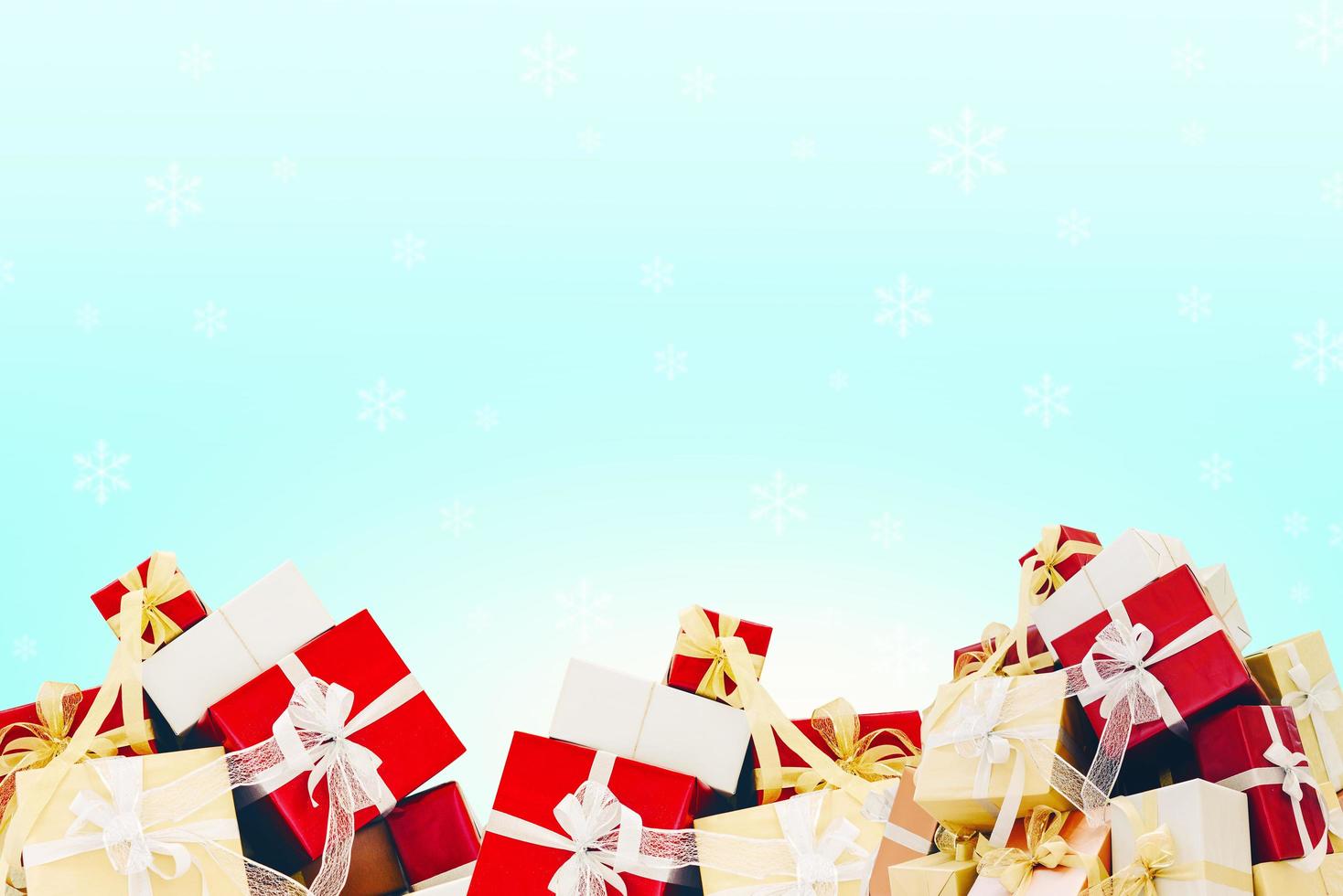 Gifts with ribbon bow on beautiful background photo