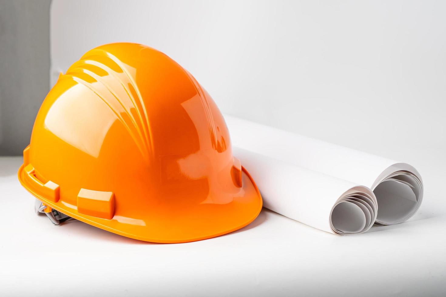 Orange construction helmet isolated on white background photo