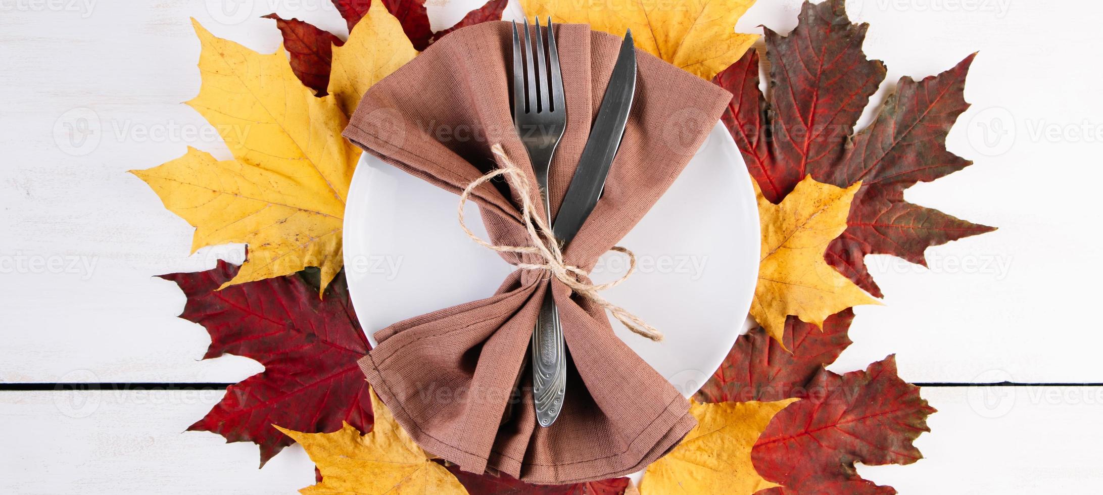 Happy Thanksgiving Day. Festive table setting on white background. photo