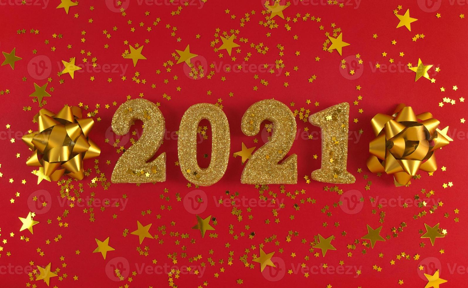 Greeting card of New Year 2021. Golden glittered figures, stars photo