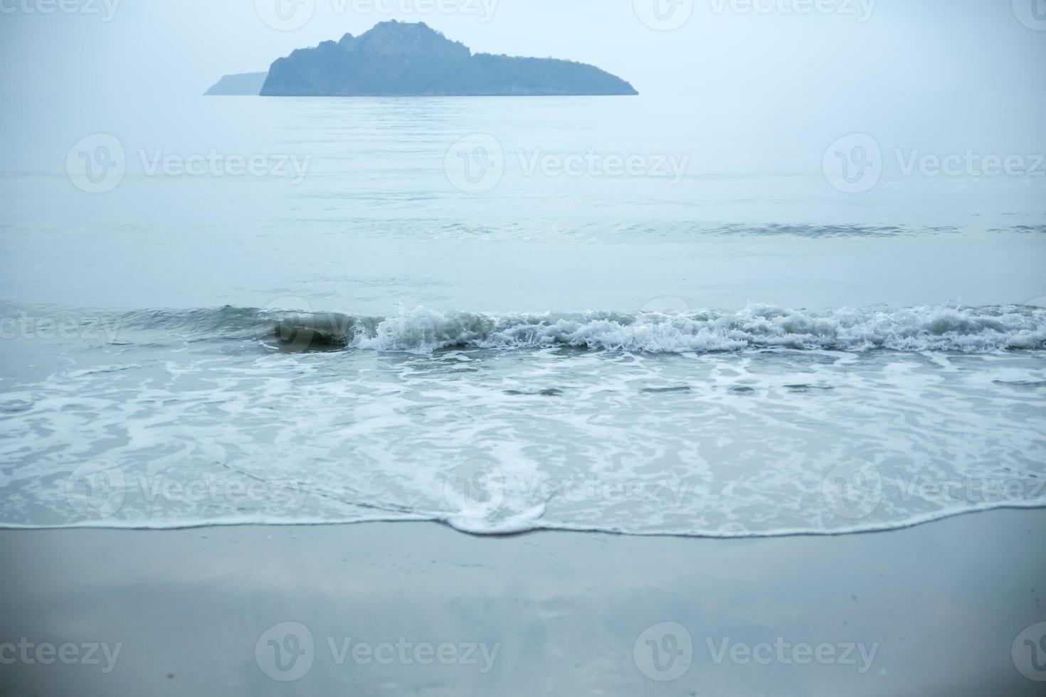 Beach with blurred island background. photo