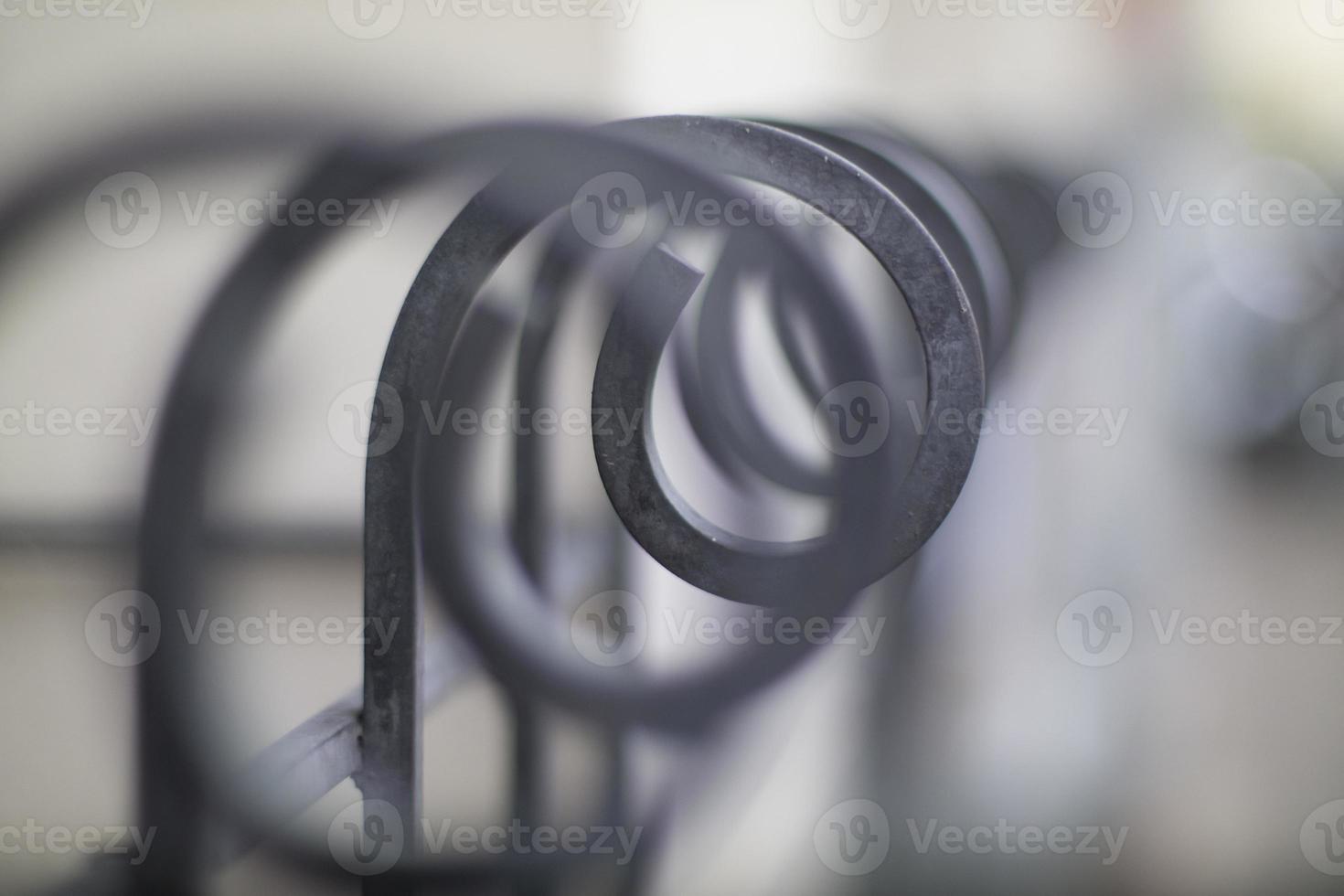 Artistic curving shape fence in shallow depth of field. photo