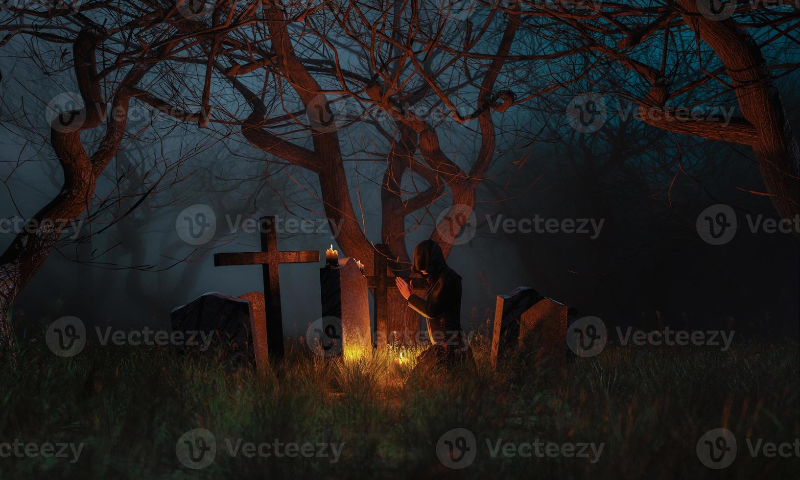 Praying in a graveyard in a spooky forest photo
