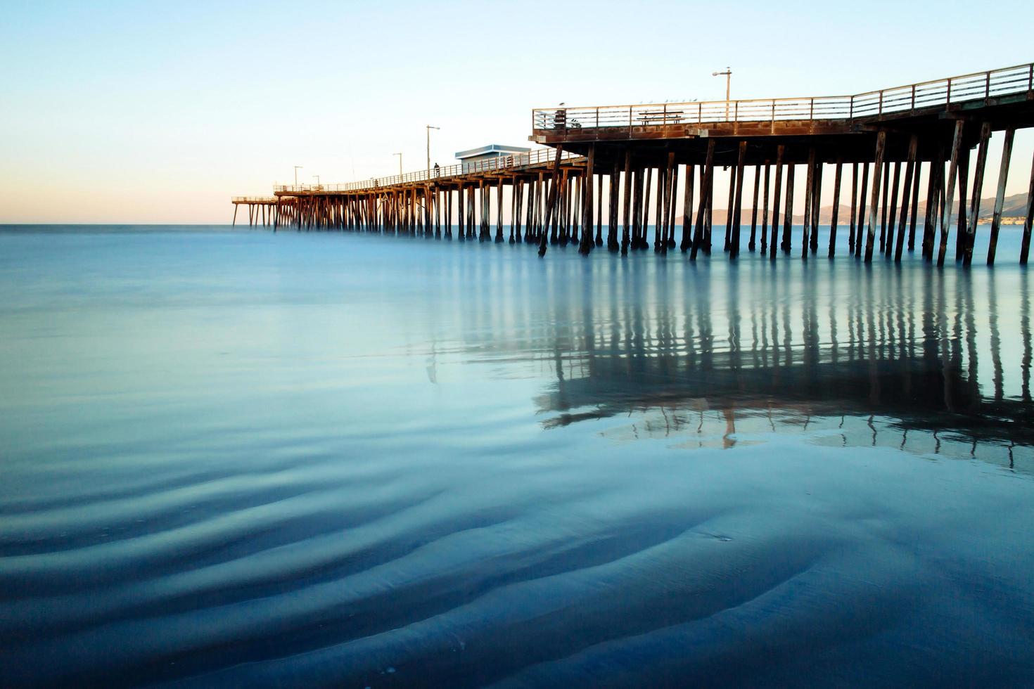 Old pier on the beach. photo