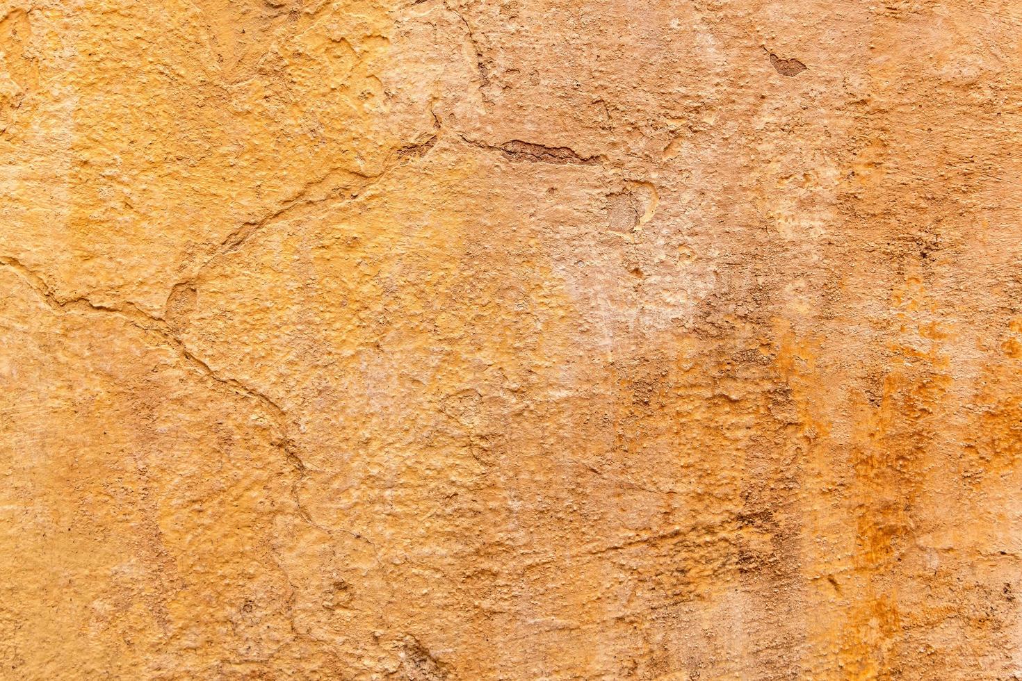 Brown adobe clay wall texture background. photo