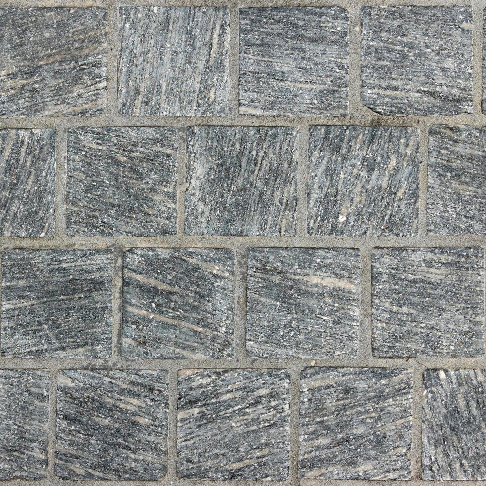Dark gray mosaic tile stone.Material construction. photo