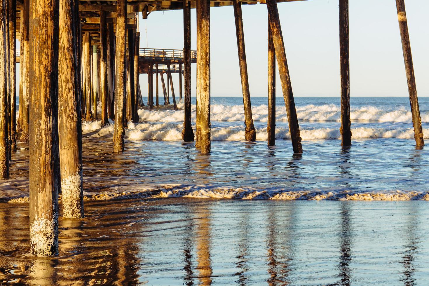 Old pier on the beach. photo