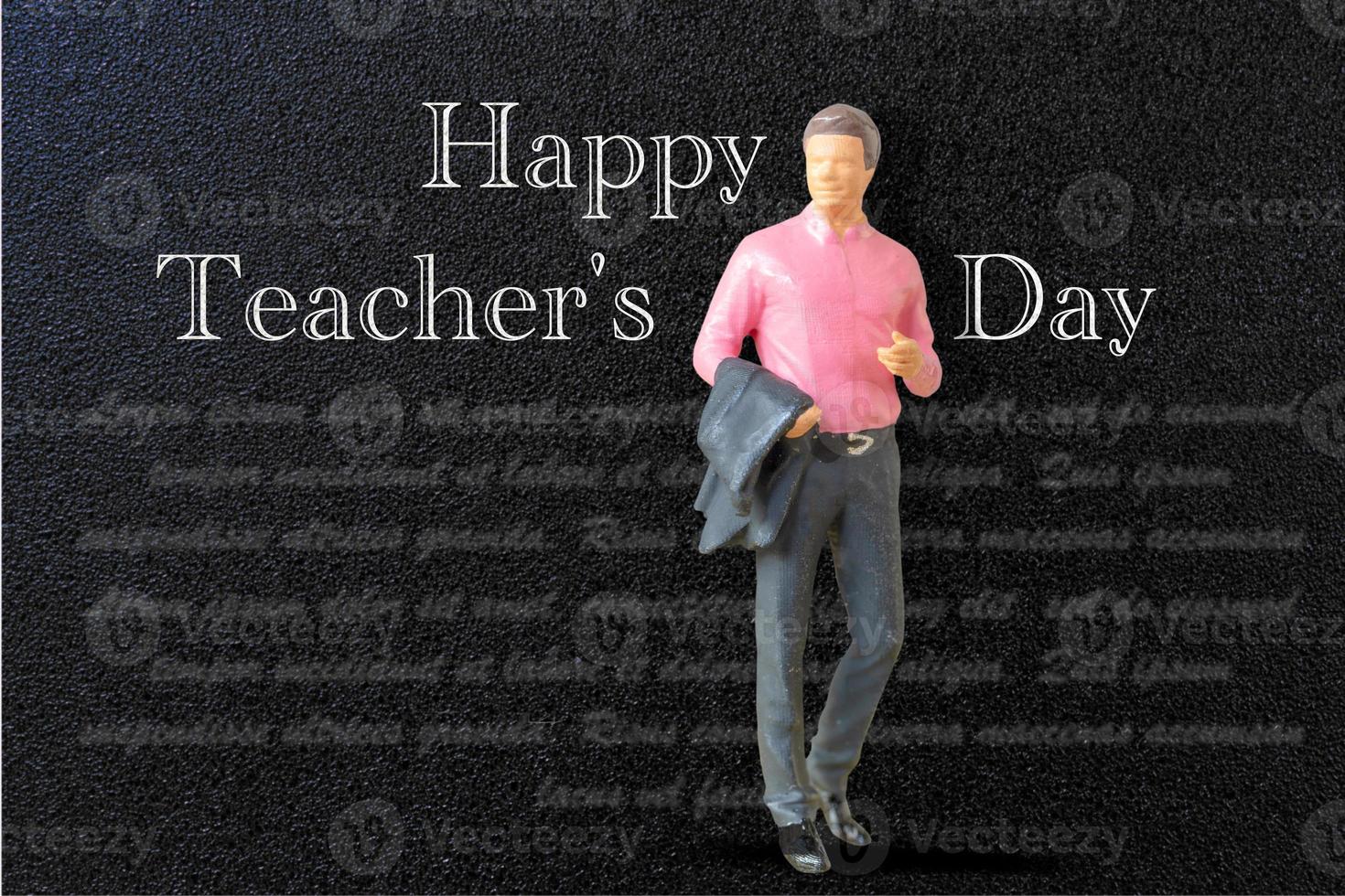 Miniature people Teacher in front of blackboard photo