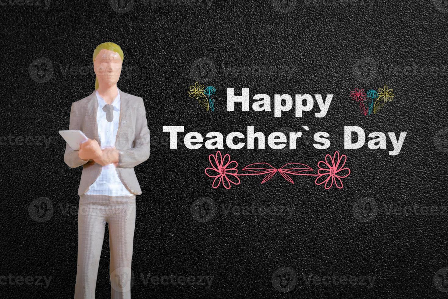 Miniature people Teacher in front of blackboard photo