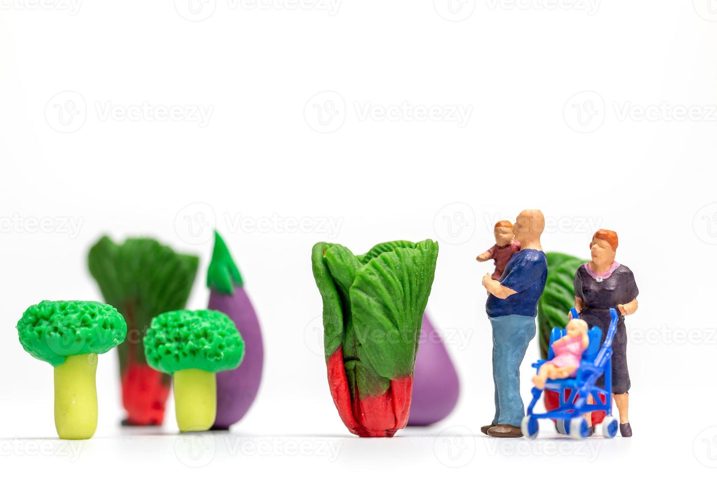 Happy family resting in vegetable farm. World Vegetarian Day concept photo