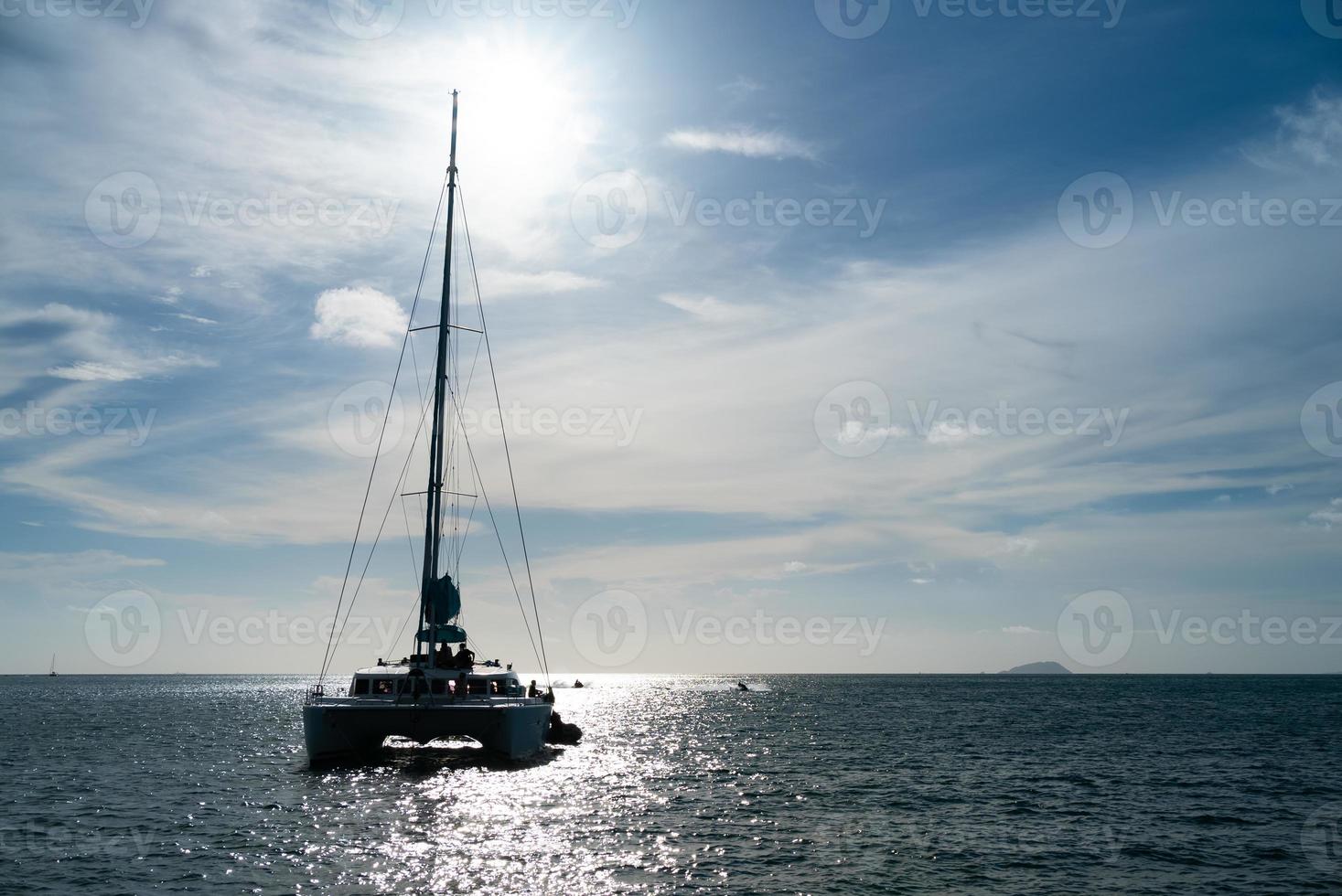 Sailboat on blue ocean in summer photo