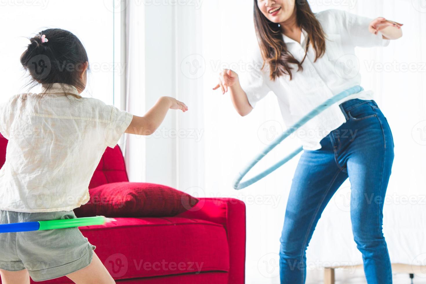 Mother and daughter hula hooping photo