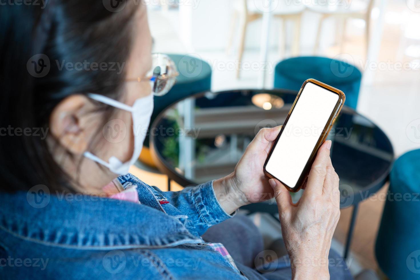 Mature woman using phone mock-up photo