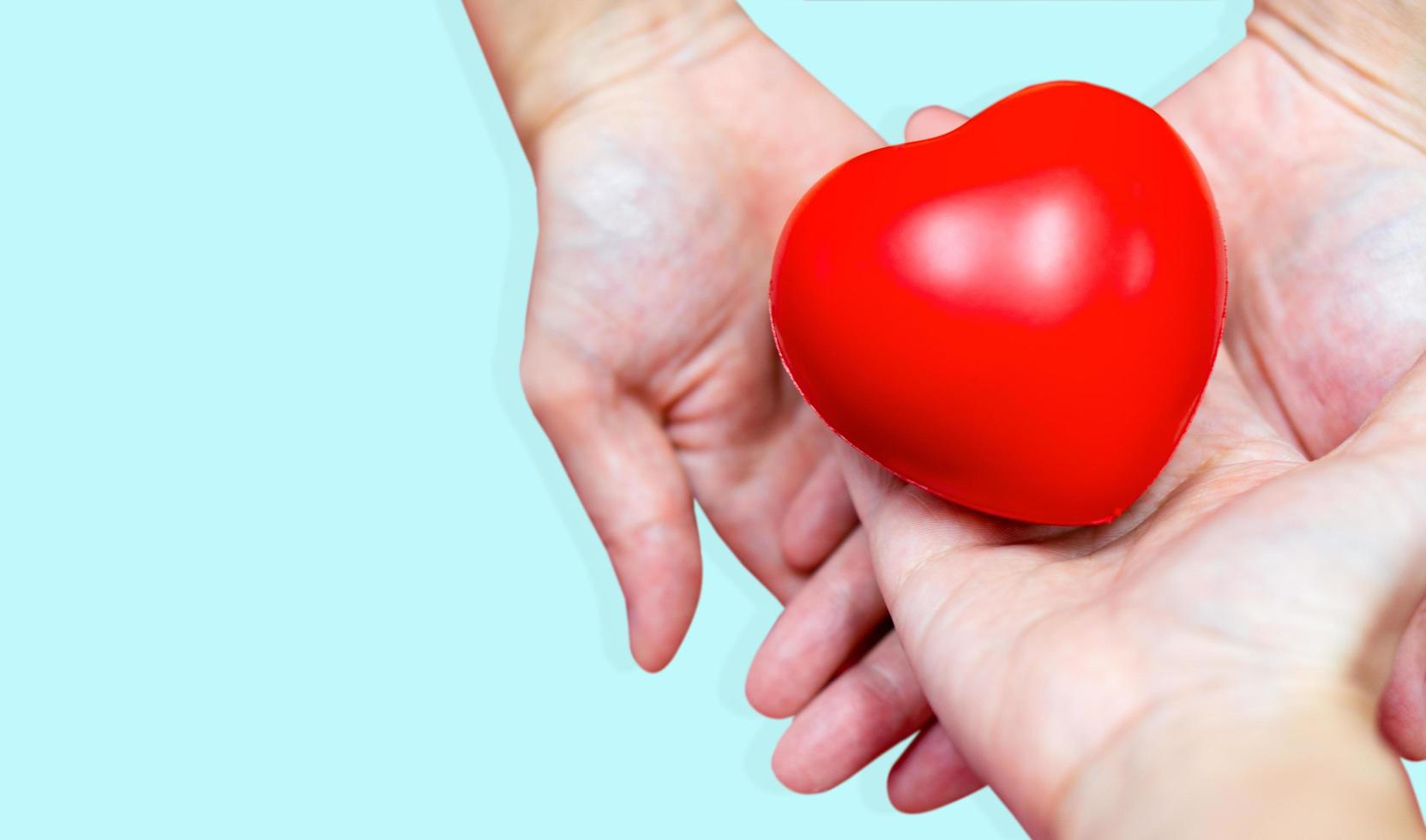 Hands holding a heart photo