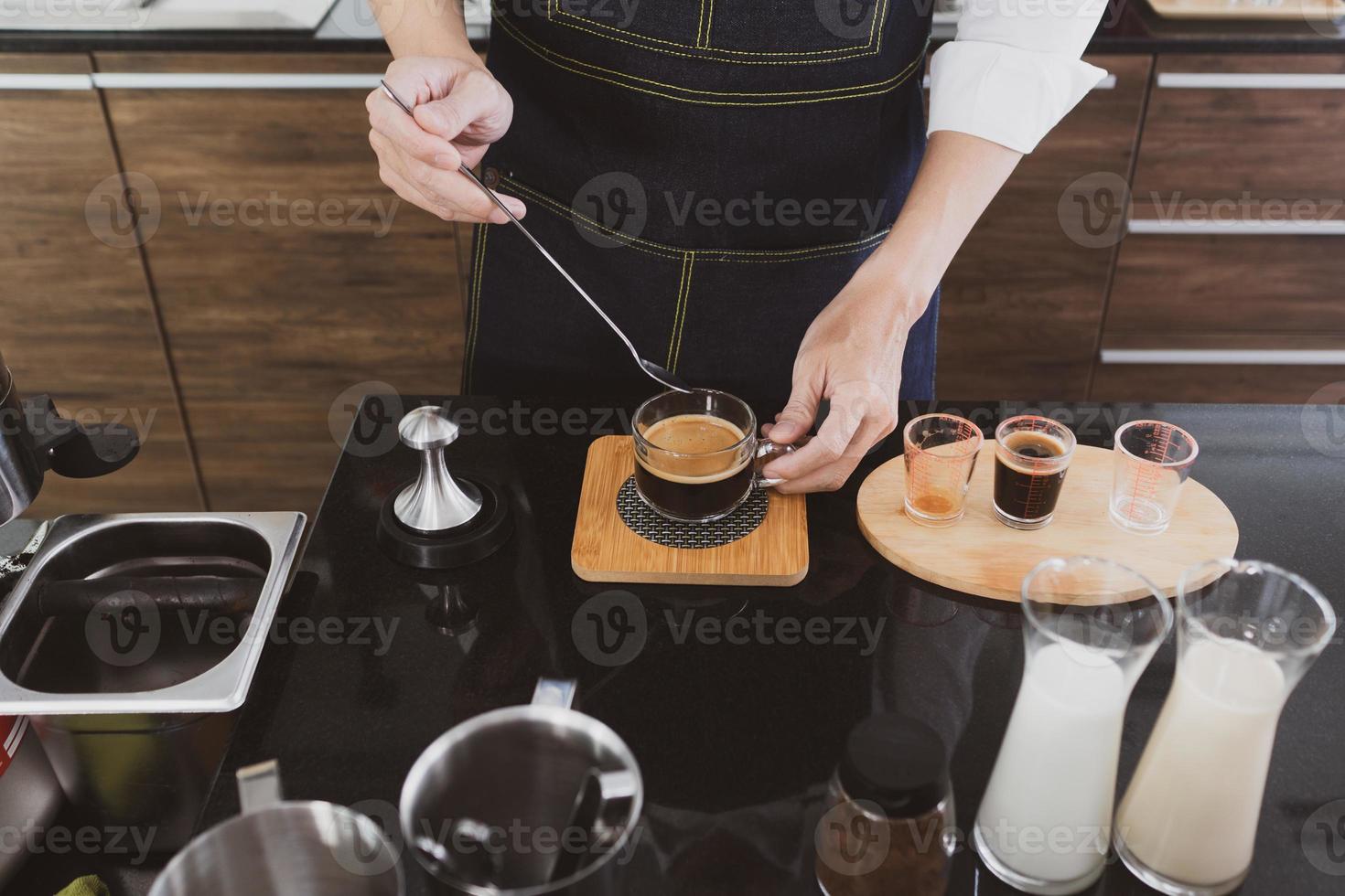Barista making coffee in cafe photo