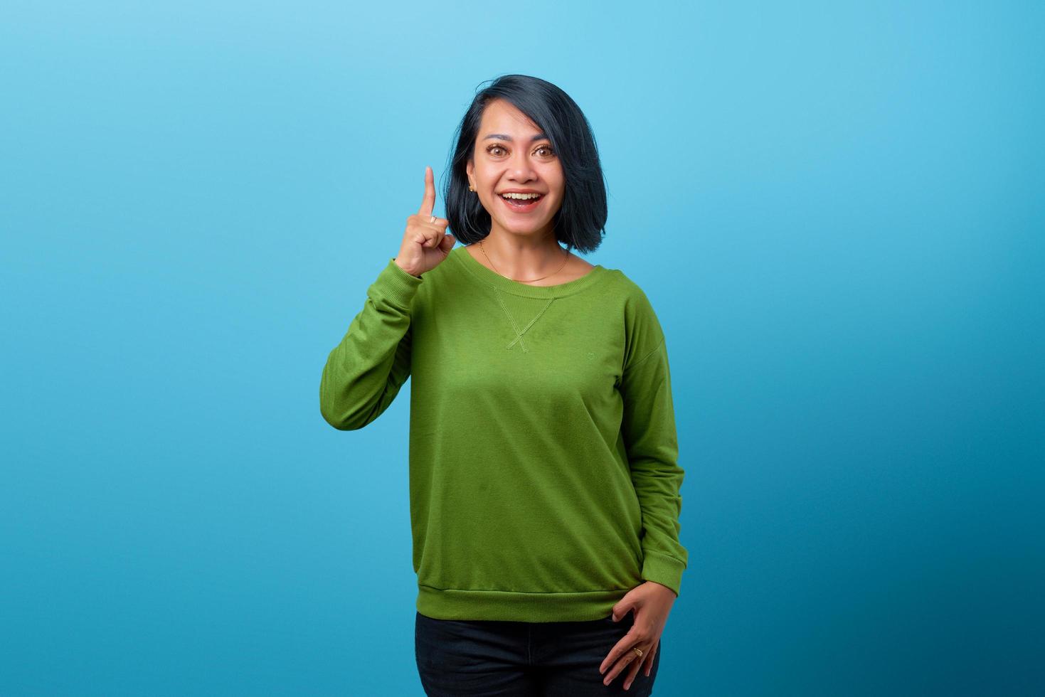 Portrait of happy Asian woman looking camera and have an idea photo