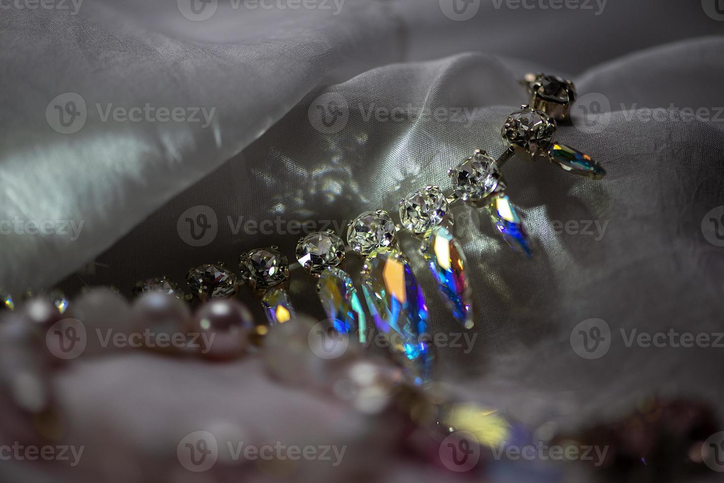 Close-up details of necklace and earrings with swarovski crystal photo