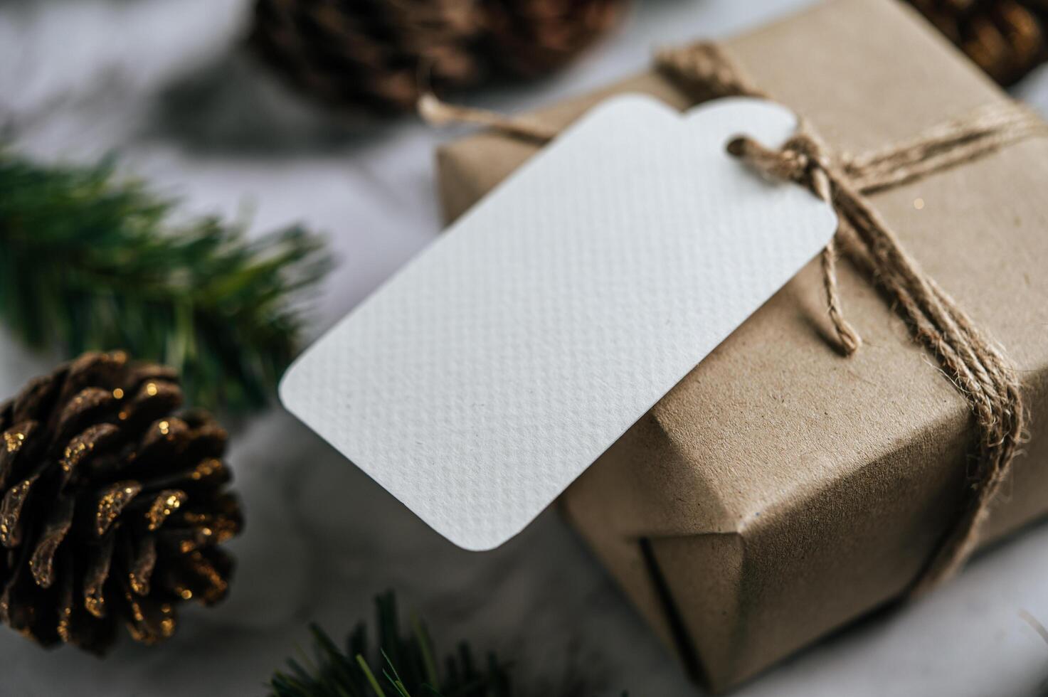 Gift boxes with small gifts on white cement photo