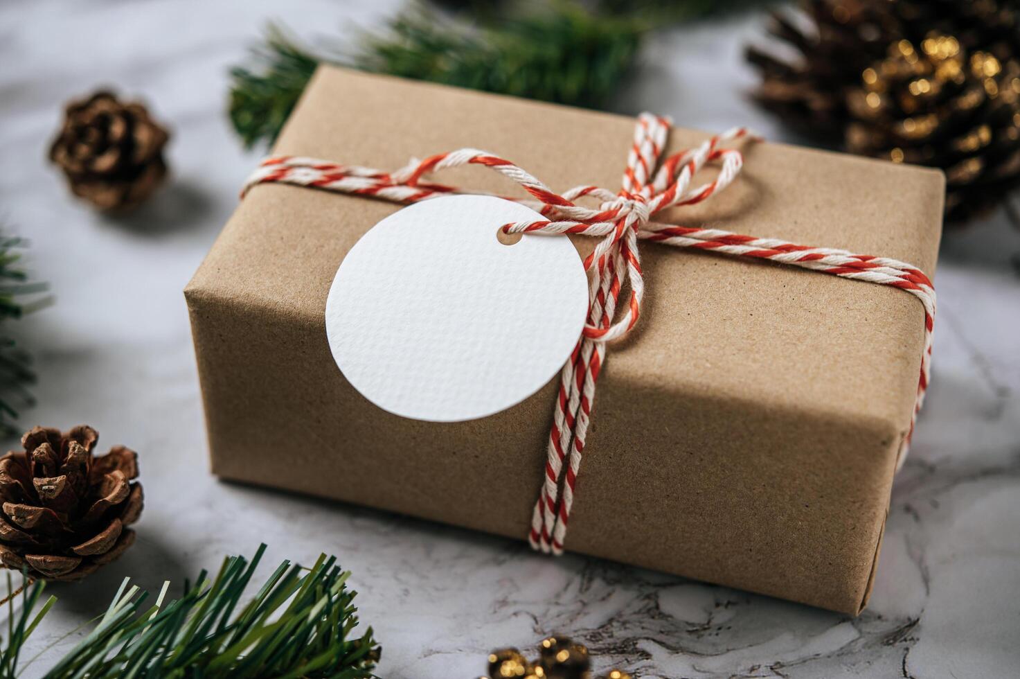 Gift boxes with small gifts on white cement photo