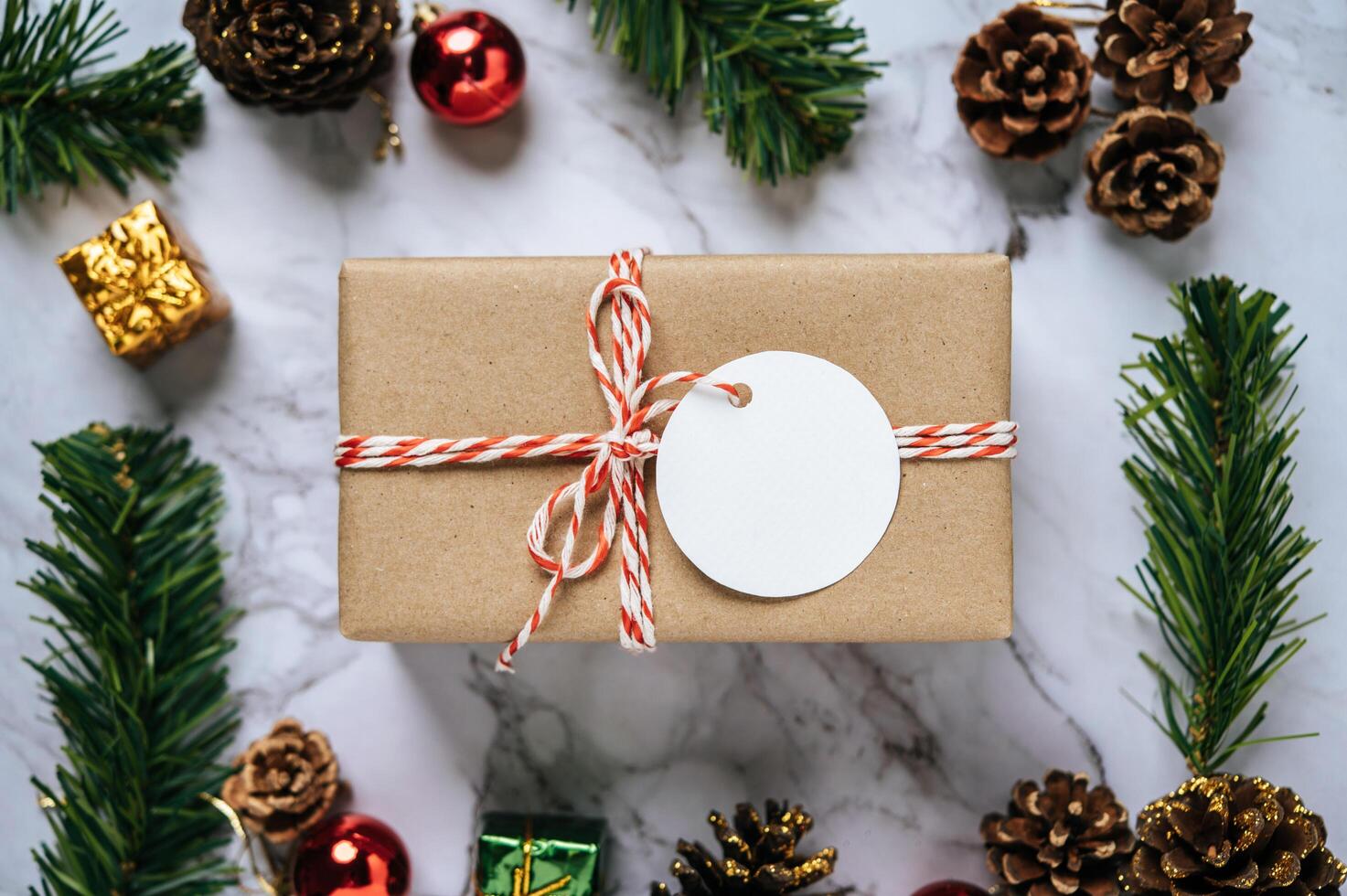 Gift boxes with small gifts on white cement photo