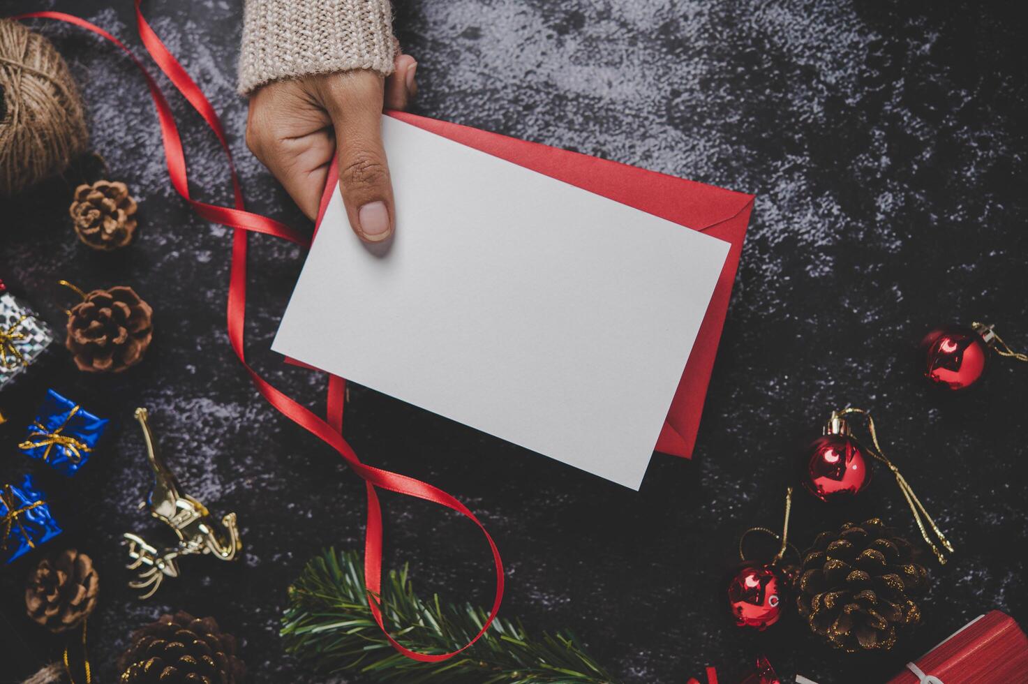 Hands holding opened card or letter photo