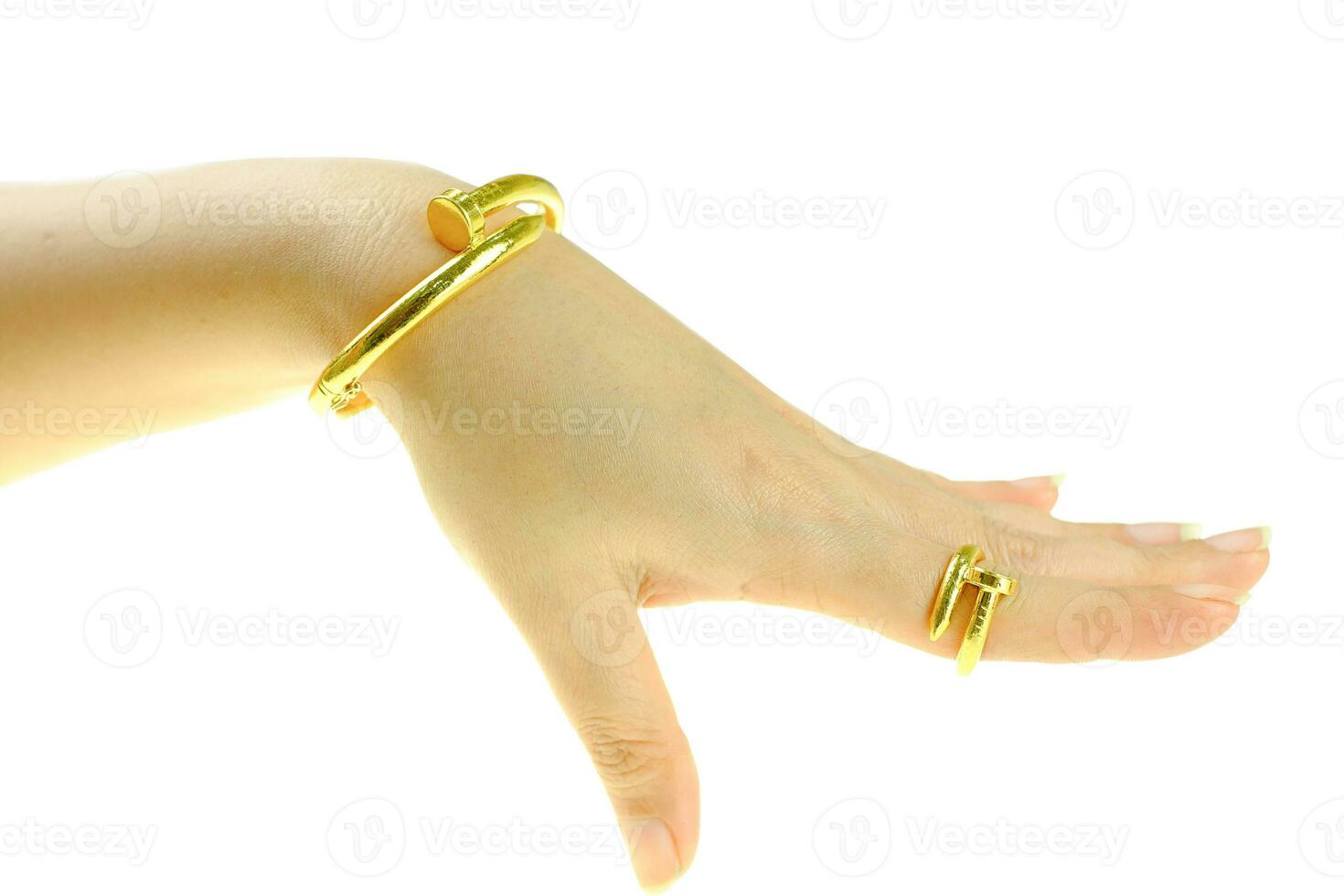 Woman's hand with a gold bracelet and ring jewelry photo