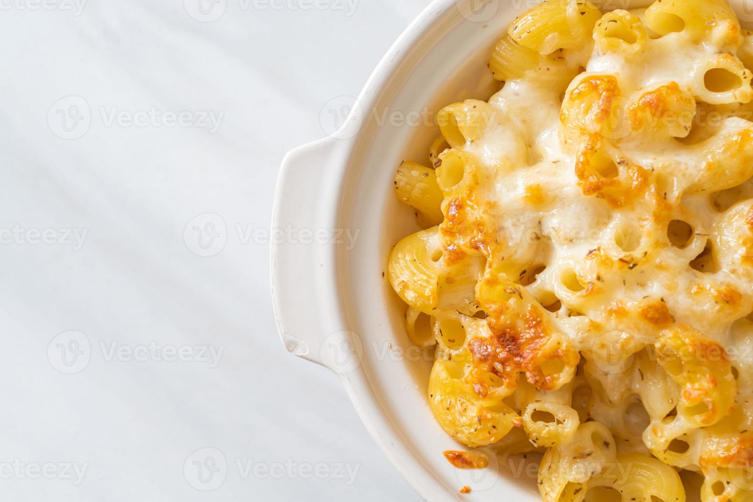 American mac and cheese, macaroni pasta in cheesy sauce photo