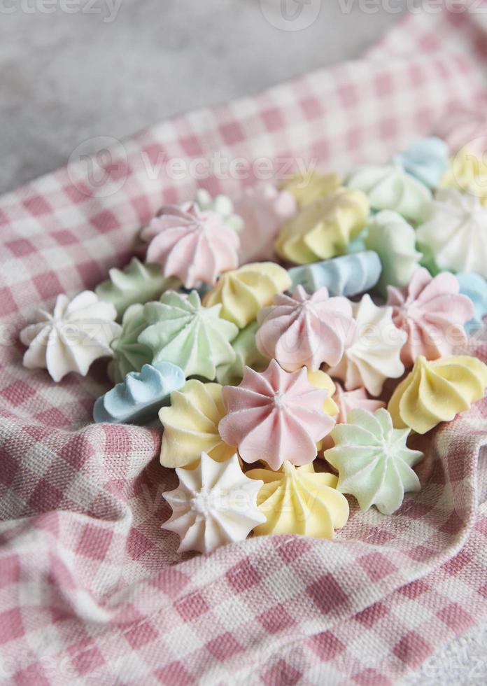 Close-up delicious meringue cookies pastel colors photo