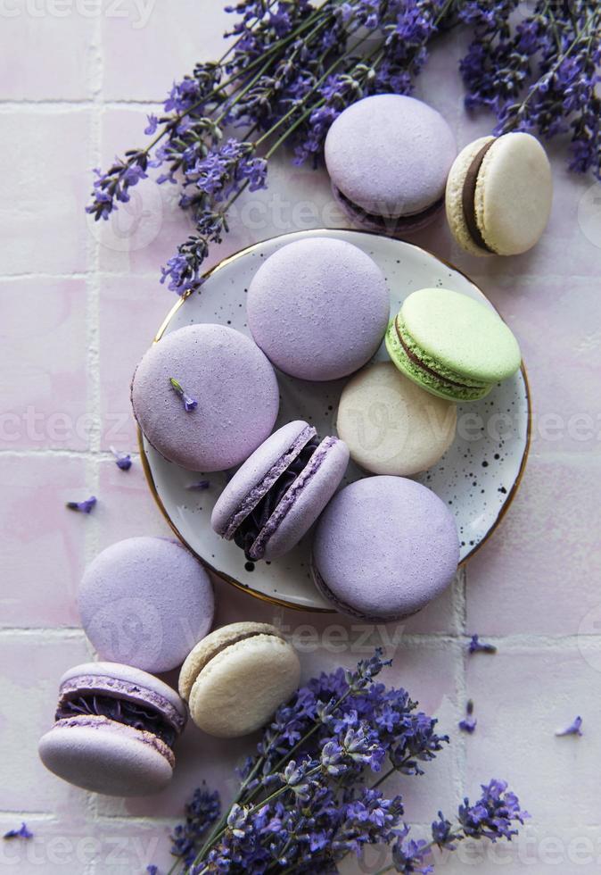 French macarons with lavender flavor and fresh lavender flowers photo