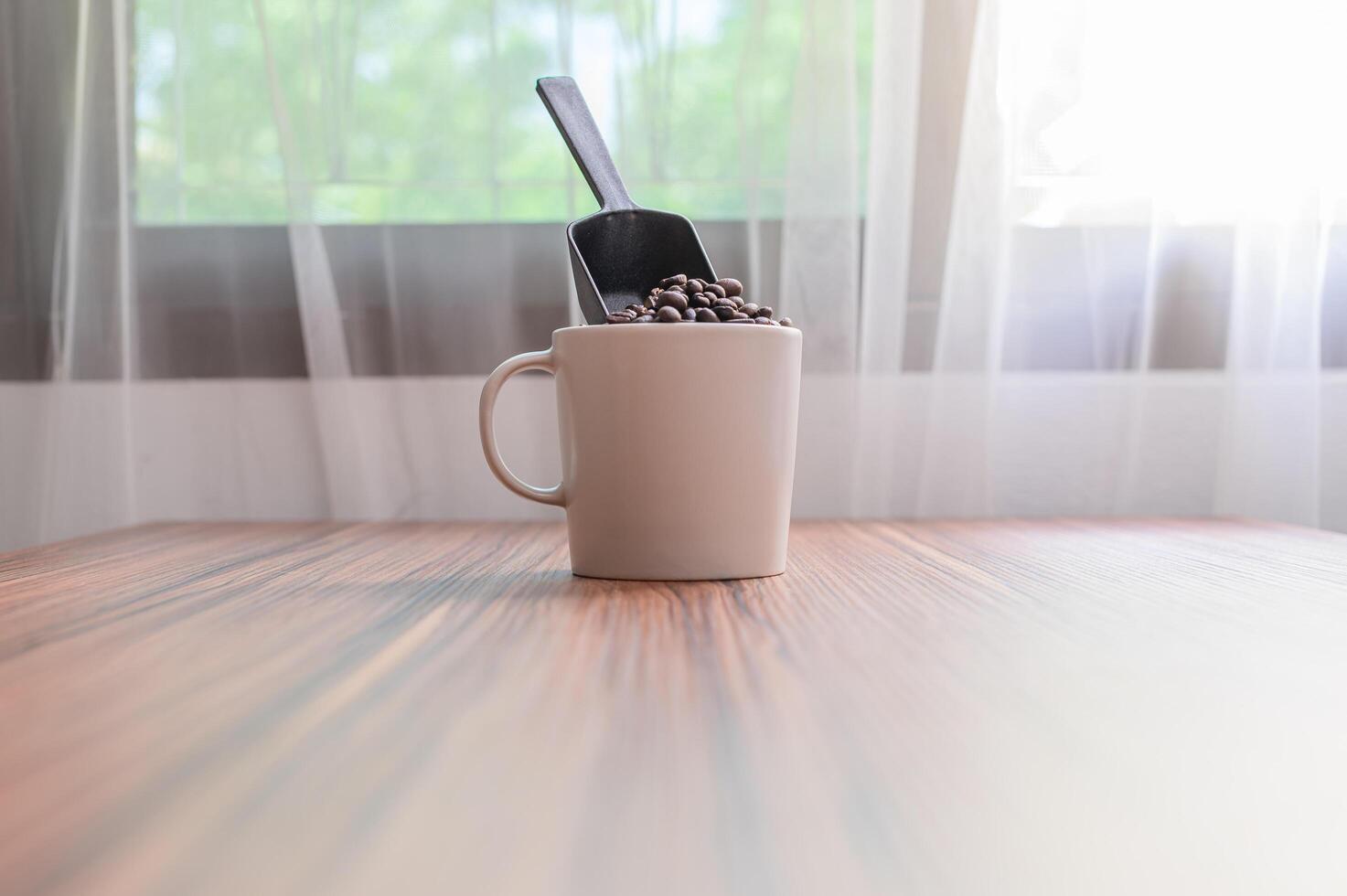 Coffee mugs and coffee beans to boost energy photo