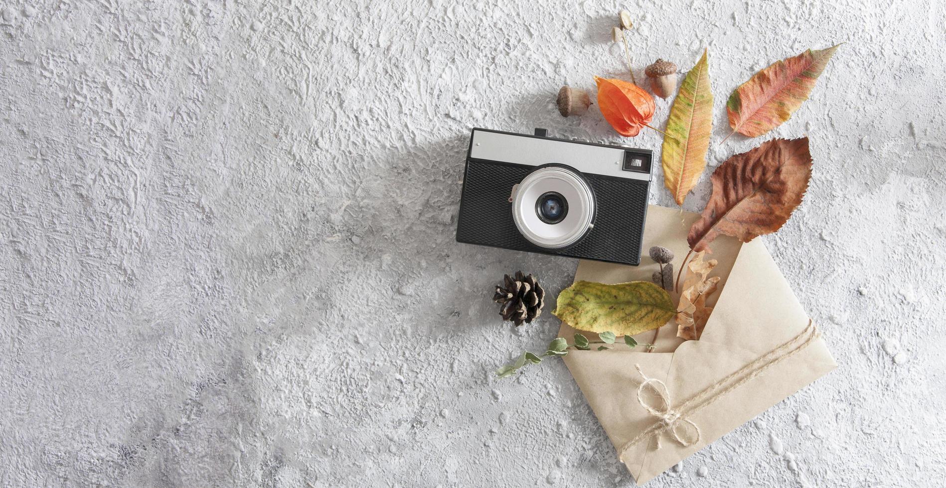 Autumn flat lay layout with vintage camera, word autumn photo