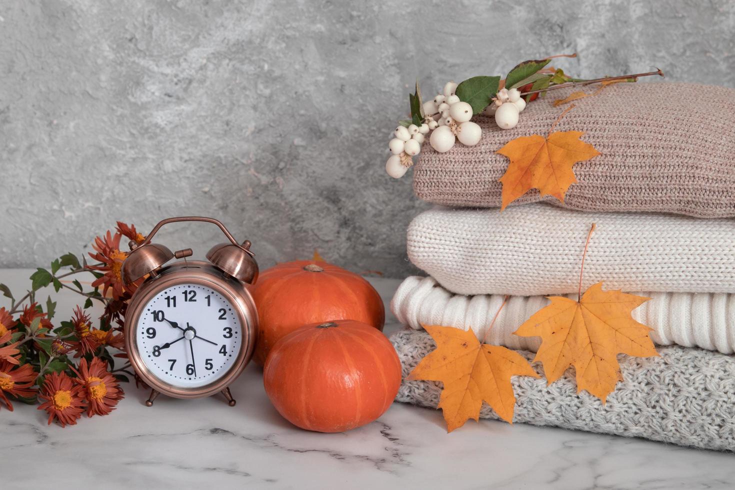 Autumn still life with knitted sweaters photo