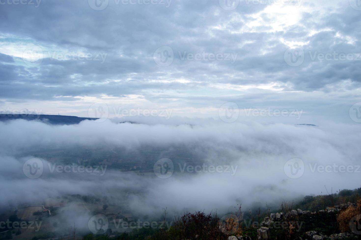 Valley covered with mountain morning fog. Mist in the valley. photo