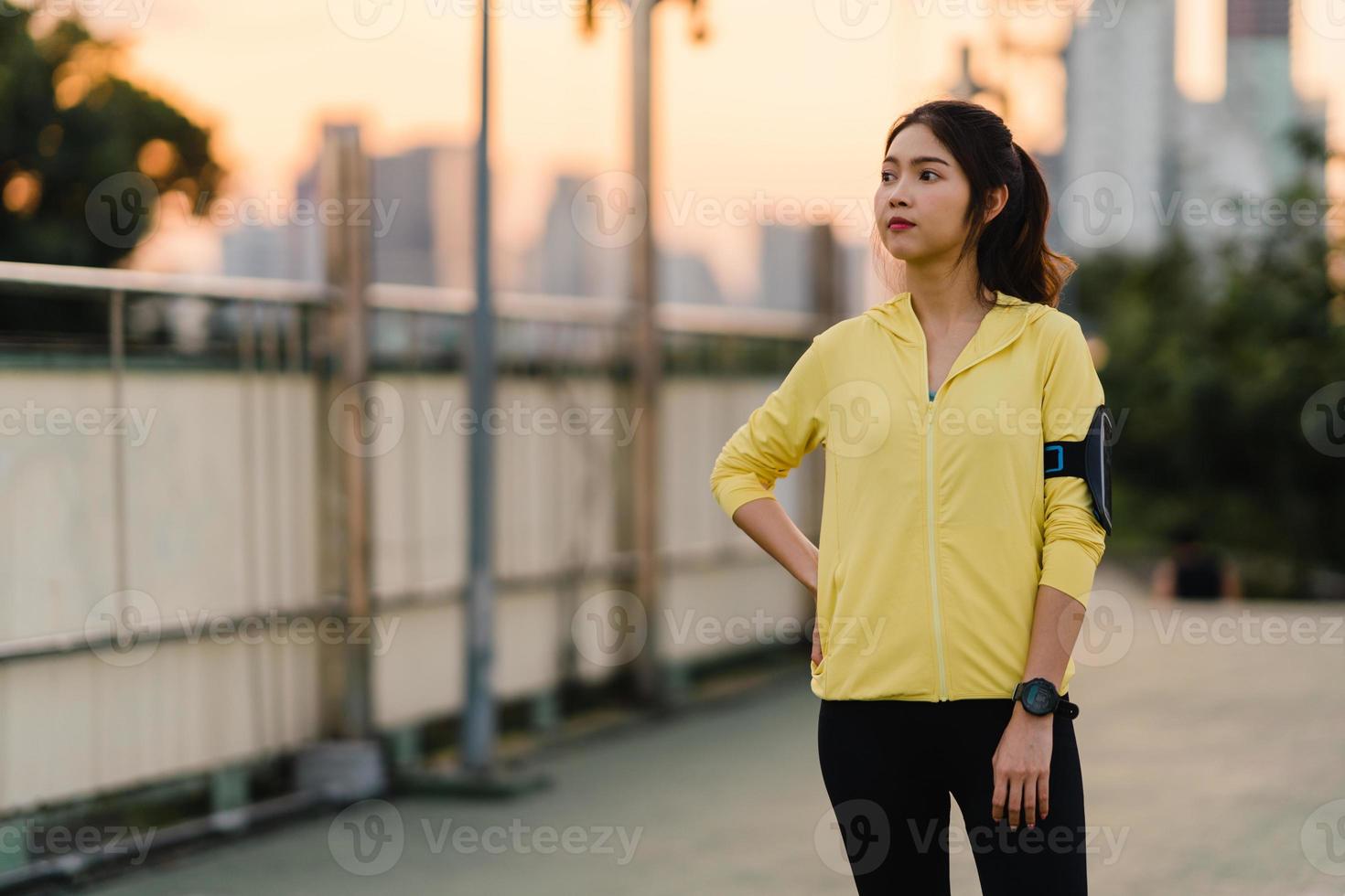 Asia athlete lady exercises doing stretch work out in urban. photo