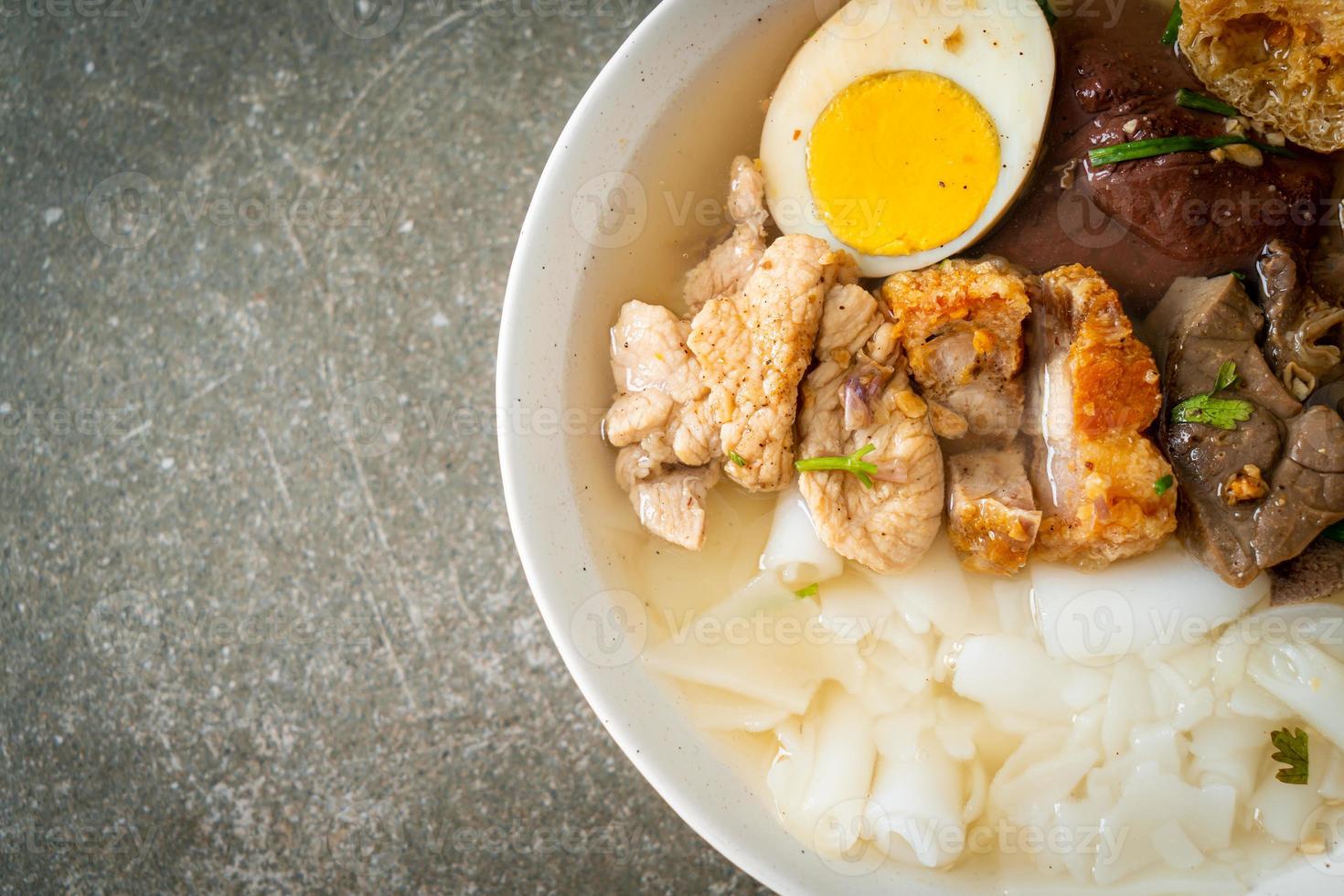 Paste of rice flour or boiled Chinese pasta square in clear soup photo